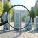 A magnifying glass focuses on a model of a modern high-rise building, surrounded by similar building models, with a tree-lined street blurred in the background. | RealEstateMarket